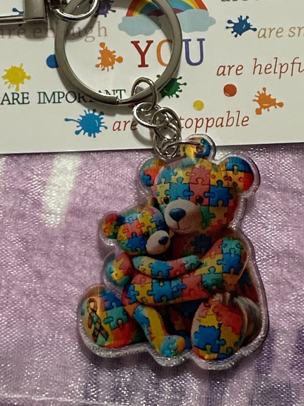 Rainbow colored Puzzle Piece Cuddling Teddy Bears Bagcharm with affirmation card